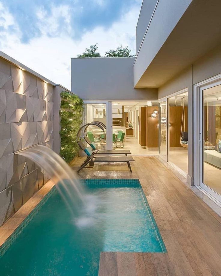 Modern pool with waterfall